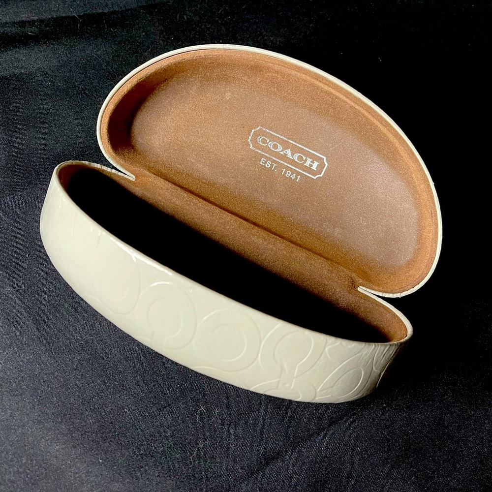 White Coach clamshell sunglasses case